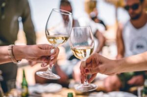 raise a glass to women in wine white wine glass toast